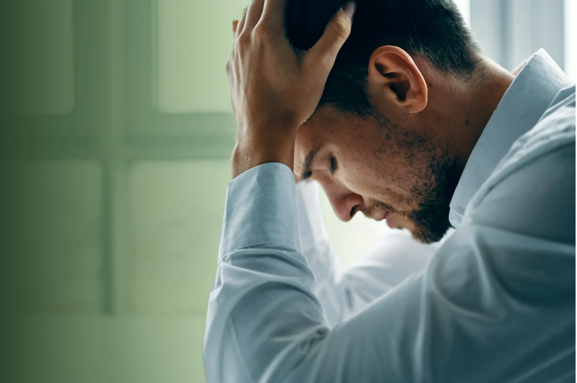 Hand presenting a digital security shield emblem, symbolizing IT Security and data protection.